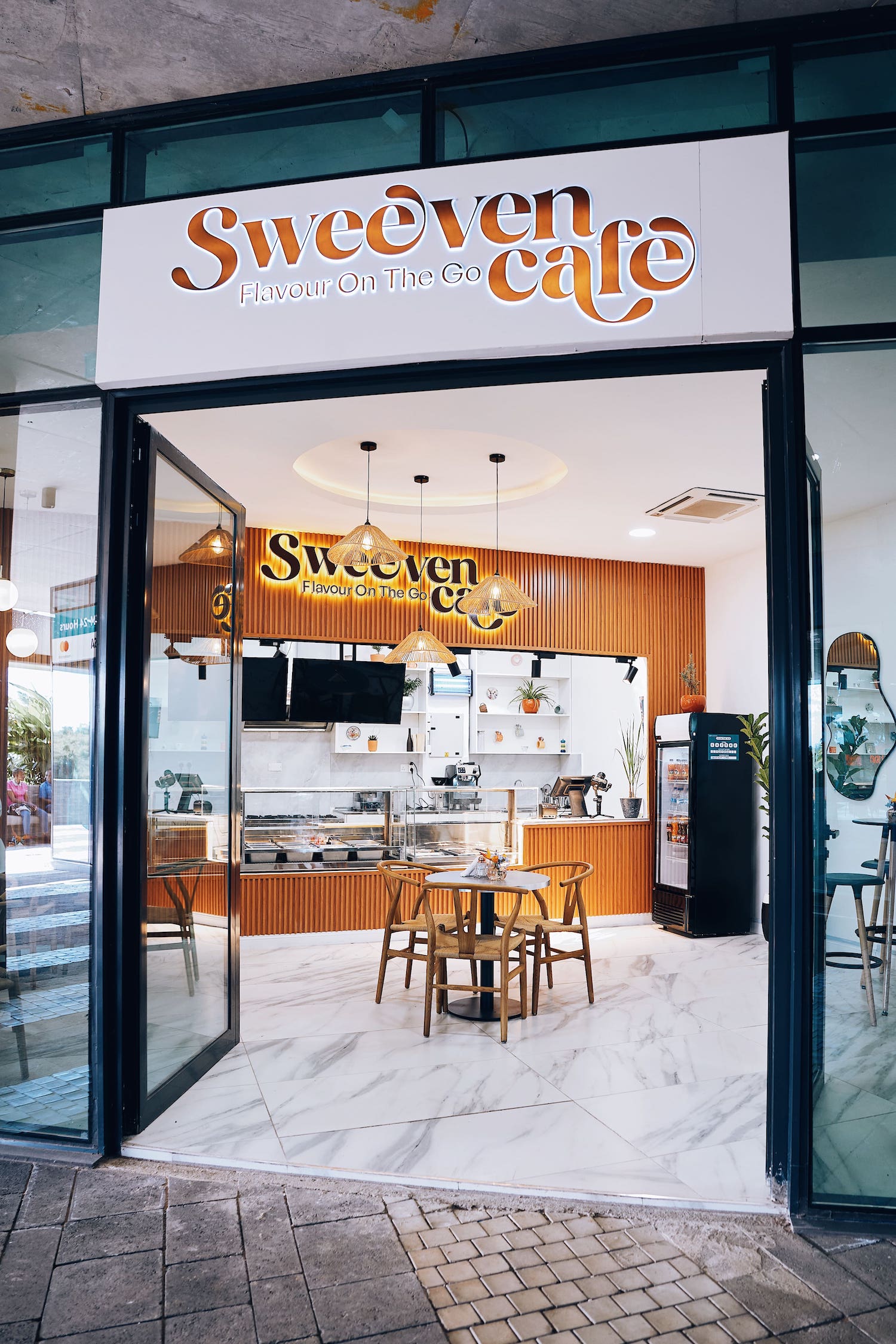 Sweeven Cafe exterior entrance with signage